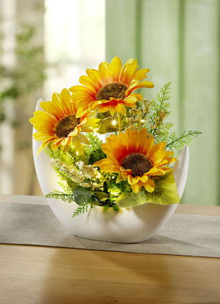 Beleuchtetes Sonnenblumen-Arrangement