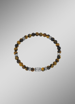 Kraftvolles Armband mit tibetischen Symbolen