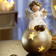 Weihnachtliche Dekorationen - Beleuchteter Engel aus Keramik, in Farbe WEISS-GOLD, in Ausführung Engel auf Kugel – Farbe WEISS-GOLD – Ansicht 1