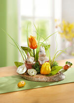 Tischgesteck auf Baumstamm 