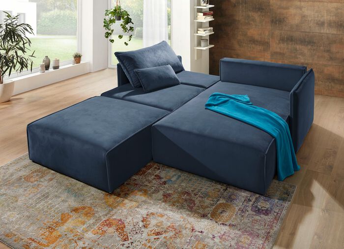 Polsterecke mit Bettfunktion und Hocker 