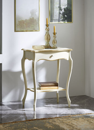 Telefontisch mit goldfarbenen Applikationen 