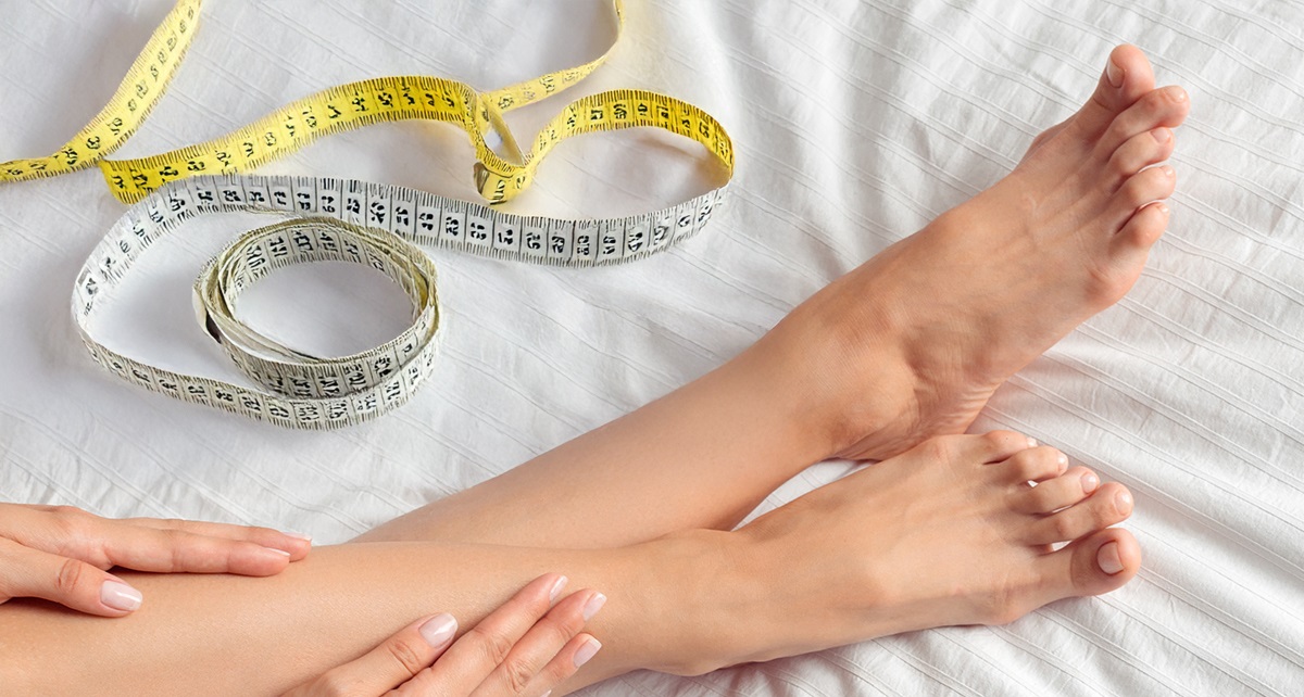 Füße und ein Massband